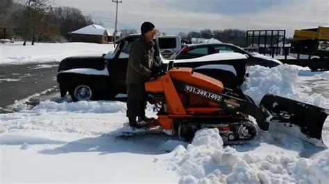 Snow Plowing With Toro Dingo 525 Mini Skid Steer Services In
