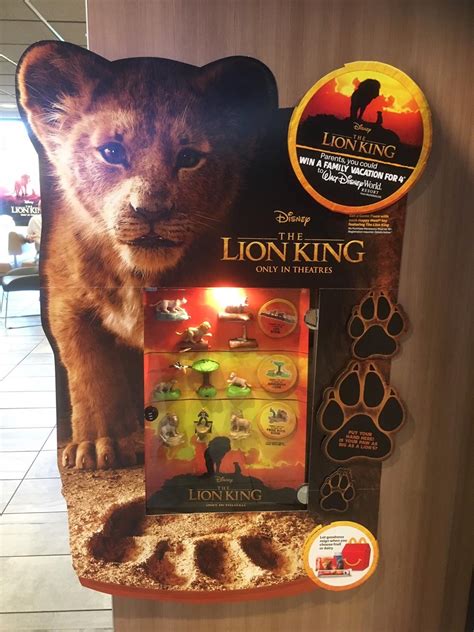 A small toy is included with the food, both of which are usually contained in a red cardboard box with a yellow smiley face and the mcdonald's logo. "The Lion King" McDonald's Happy Meal Toys Now Available ...