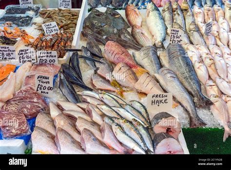 Different Kinds Of Fish And Prawns For Sale At A Market In Brixton