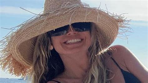 heidi klum proudly shows off toned physique as she struts topless in sizzling holiday snaps