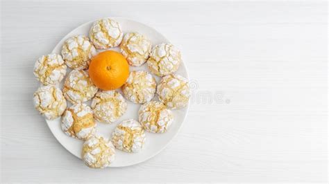 Homemade Orange Crinkle Cookie Powdered Sugar And Orange Fruit On White
