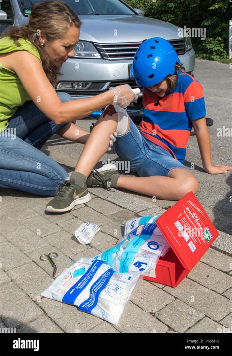 Symbolic Photo First Aid Scene Posed Wound Care After A Bike