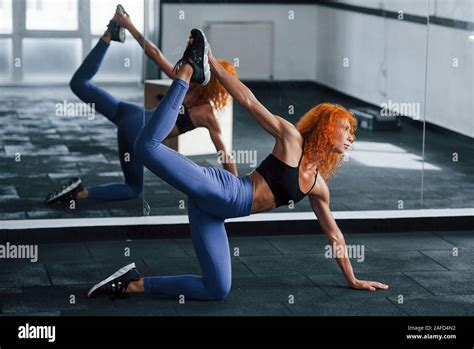 Strength And Flexibility Sporty Redhead Girl Have Fitness Day In Gym At Daytime Muscular Body