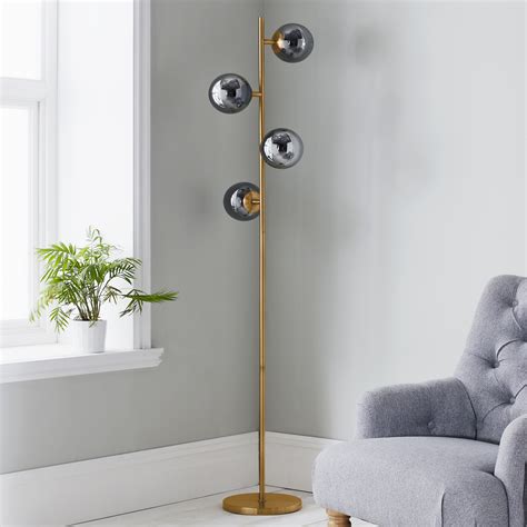 A floor lamp is a classic way to light any space, from a public office to a private bedroom. Lighting | Floor Light | Inner Home | Four Sphere Gold Tall Floor Lamp