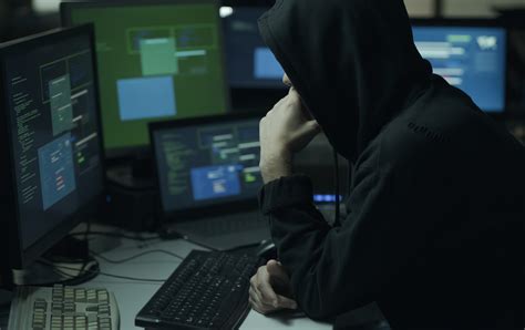 Hacker With Hoodie Working With A Computer Nanoapps Medical
