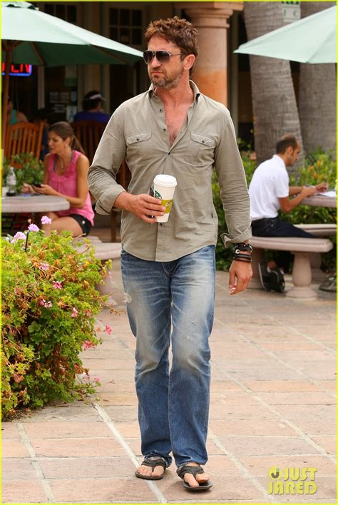 gerard butler scopes out surf gear after kissing session with mystery girl photo 3169586