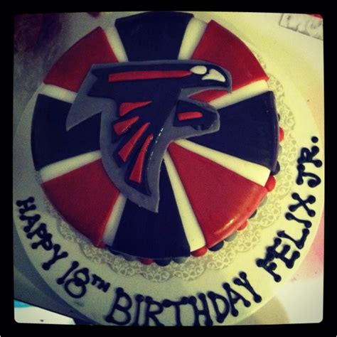 A Birthday Cake Decorated With The Atlanta Falcons Logo