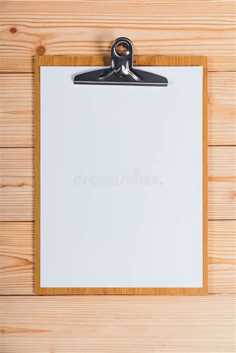 Clipboard With Blank White Paper Sheet On Wood Table Top View Wi Stock