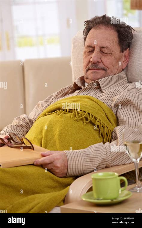 Senior Man Sleeping In Armchair Stock Photo Alamy