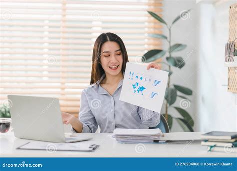 A Businesswoman From A Millennial Startup Is Depicted Working With