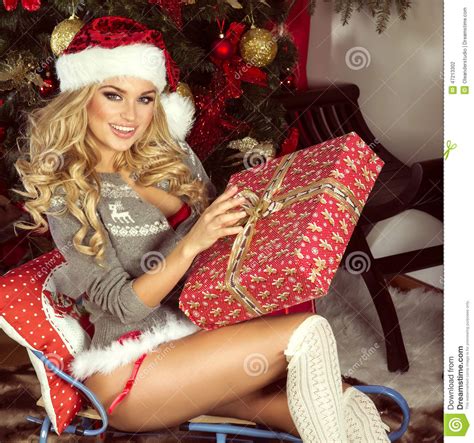 Sensual Blonde Girl In Santa Claus Costume Stock Photo Image Of Home Hairstyle