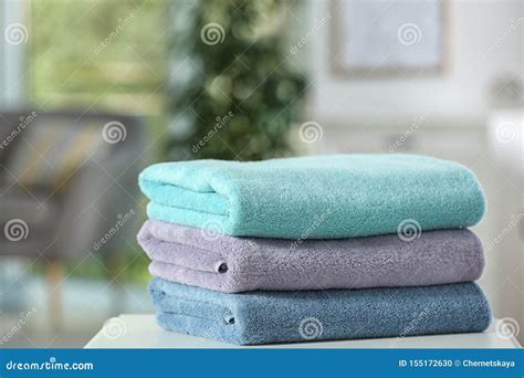 Stack Of Folded Clean Soft Towels On Table Stock Photo Image Of Bath