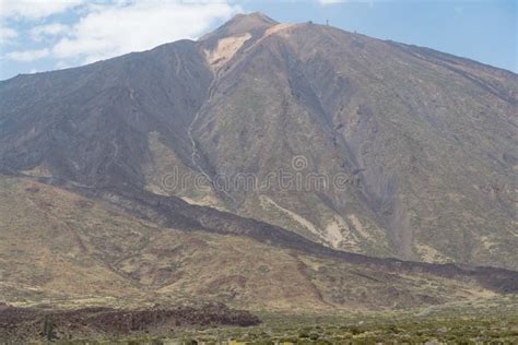Teide Volcano Landscape From A Plain With Blue Sky And Clouds Above