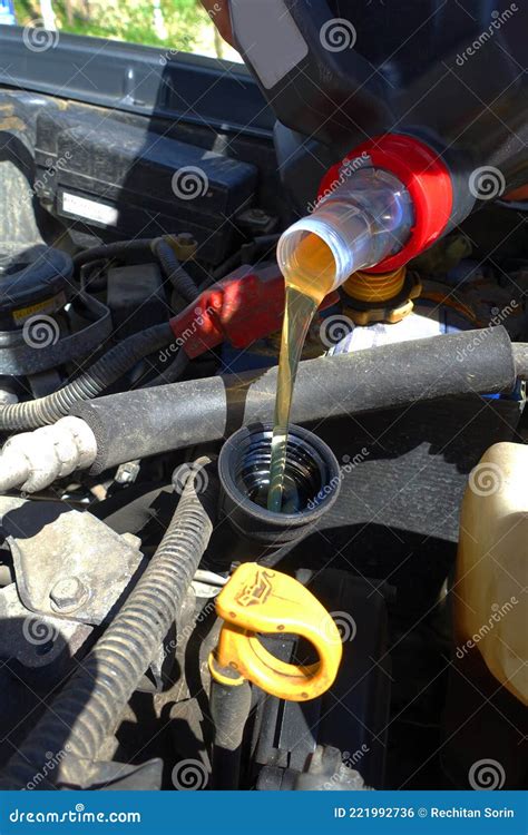 The Mechanic Completes The Engine Oil Level Stock Photo Image Of