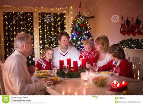 Explore our easy dinner ideas for kids to find a dish they will gobble up without any questions asked. Family Enjoying Christmas Dinner At Home Stock Photo ...