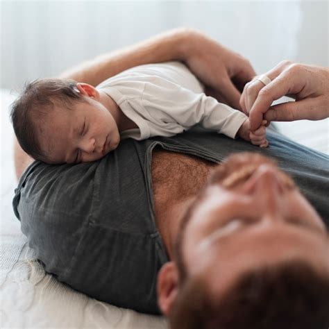 Free Photo Close Up Baby Sleeping On Dads Chest