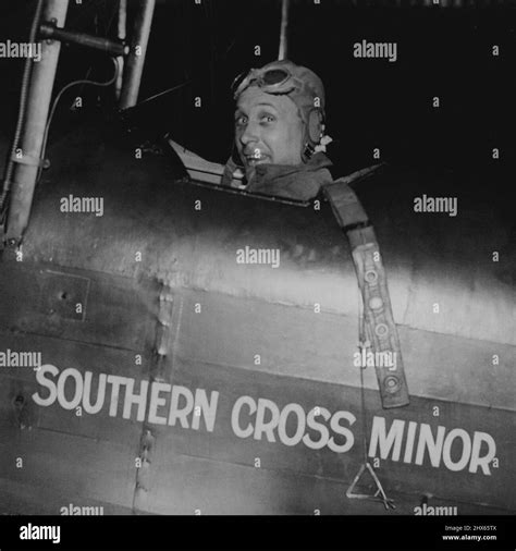 Lancaster Takes Off On Cape Flight -- Captain Lancaster in the cockpit