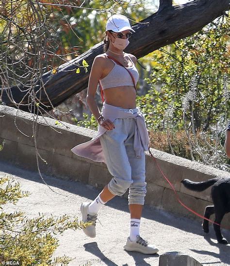 Alessandra Ambrosio Flashes Toned Midriff During Hike With A Muscly
