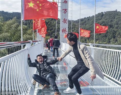 See How Scared Tourists Walked On Glass Bottomed Bridge In China