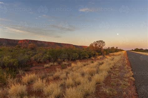 Image Of Sunset On A Roadside In Arid Australia Austockphoto