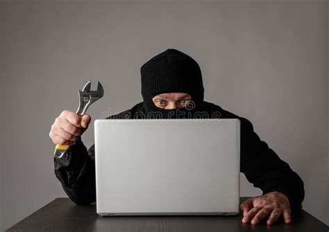 Hacker In Mask Using A Laptop Stock Photo Image Of Hidden Firewall