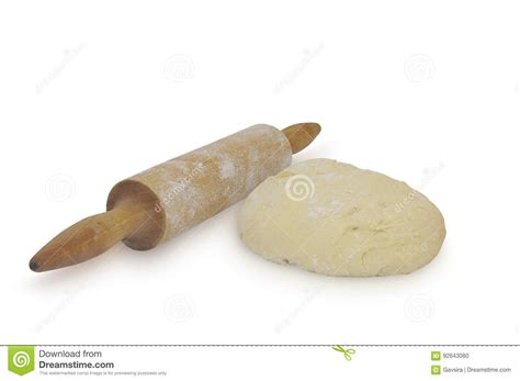 Rolling Pin And Yeast Based Dough After Rising On White Background