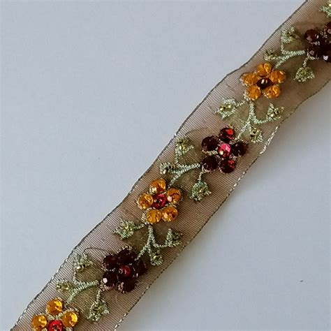 Gallone — recorded in many spellings including gallo, gallelli, gallone, and gallaccio, this is an italian nickname surname. Gallone | Organza con fiori in strass gialli - Merceria ...