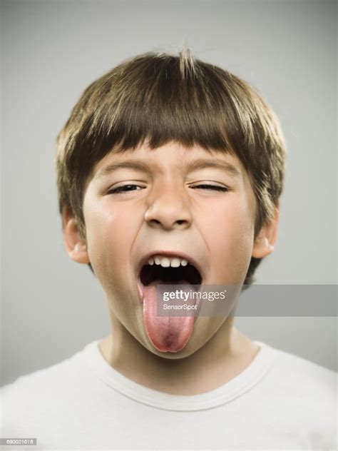 Little Kid Sticking Out His Tongue High Res Stock Photo Getty Images