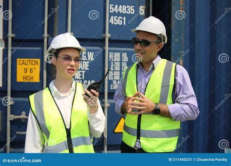 Logistics Engineer Control At The Port Loading Containers For Trucks