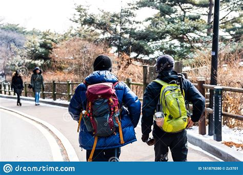 Korean Backpacker Climbing Up The The Namsan Mountain In Winter In
