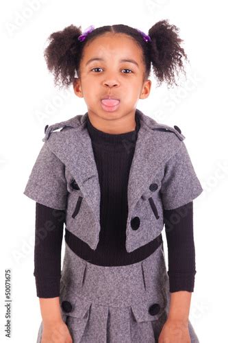 Young African Girl Sticking Tongue Out Isolated On White Backgr Stock
