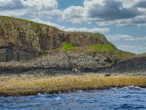 Columns Of Jointed Volcanic Basalt Rocks On The Island Of Staffa In The