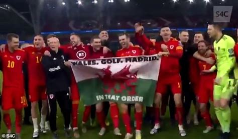 The forward posed with a flag with the words 'wales, golf, madrid. sport news Gareth Bale flying the flag and 'laughing at Real Madrid' has infuriated their ...
