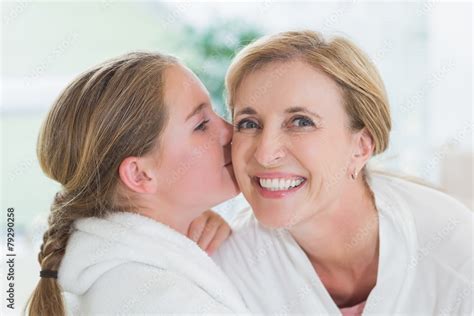 Pretty Babe Girl Kissing Her Mother On Cheek Stock Photo Adobe Stock