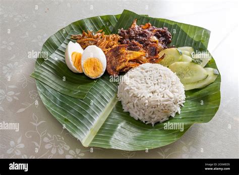 Basic Authentic Simple Nasi Lemak On Banana Leaf Served With Sambal