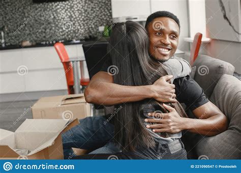 Asian Wife And Black Man Hugging In Their Flat Stock Image Image Of Happy Home 221090547