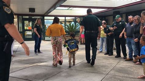 Florida Sheriff And Deputies Escort Son Of Fallen Deputy To First Day