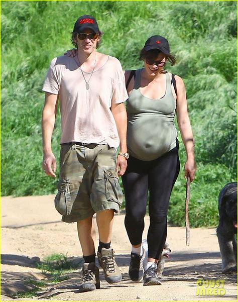 Pregnant Milla Jovovich Shows Off Her Growing Baby Bump While Rocking