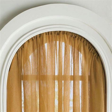 What i don't think works here is the use of pinoleum blinds at the horizontal part of the window. Curtain Ideas: Bendable curtain rods for arched windows