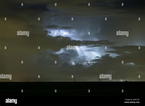 Dramatic Night Image Of A Cumulonimbus Storm Cloud Illuminated By