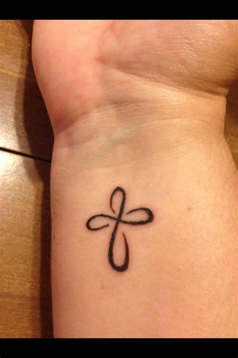 You can try a small celtic cross tattoo on the wrist too. Pin on Tattoos
