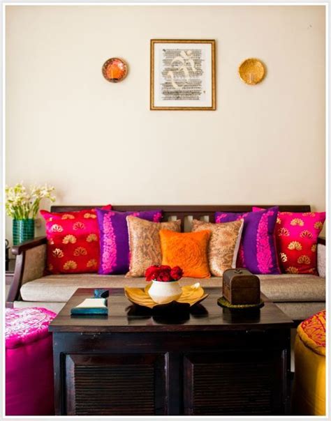 A Living Room Filled With Lots Of Furniture And Colorful Pillows On Top