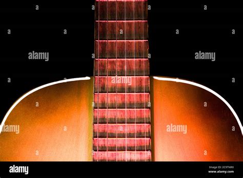 Acoustic Guitar Soundboard With Part Of The Fretboard And Illuminated