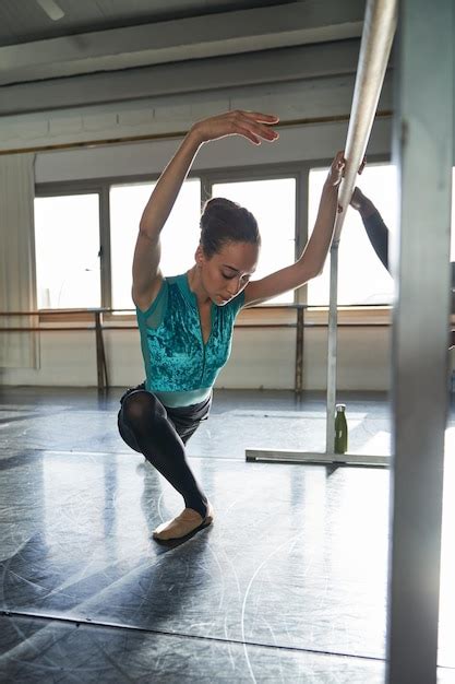 Premium Photo Ballet Dancer Warming Up And Dancing At A Dance Academy