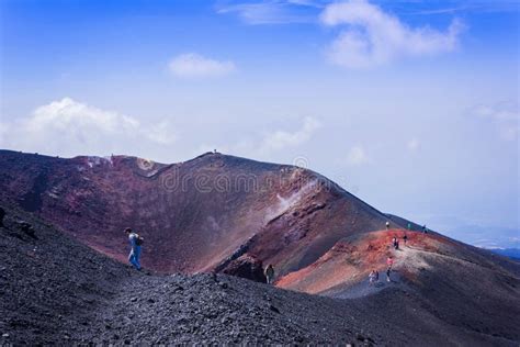 People Walking On Mount Etna Active Volcano On The East Coast Of