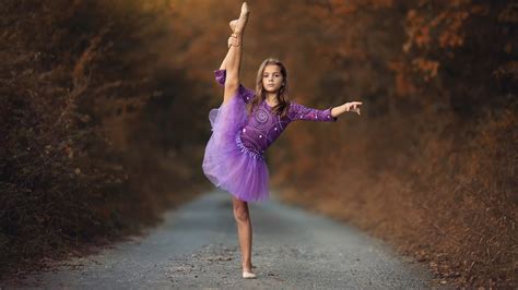 Cute Little Girl Is Standing On Road Giving Dance Pose Wearing Lavender