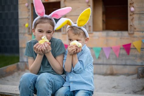 Brother And Sister In Bunny Ears Celebrate Easter Children Play With