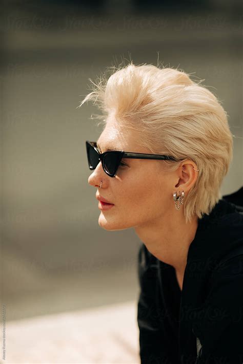 Street Portrait Of Beautiful Woman With Retro Sunglasses By Stocksy