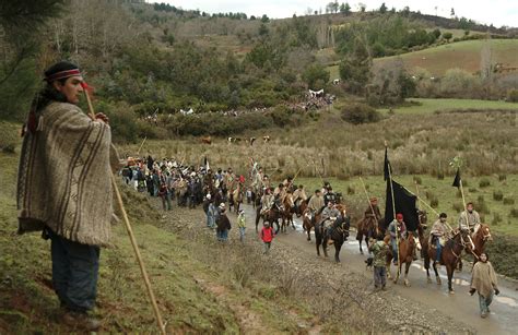 Members Of The Mapuches Indians Movement Ride Their Horses During The