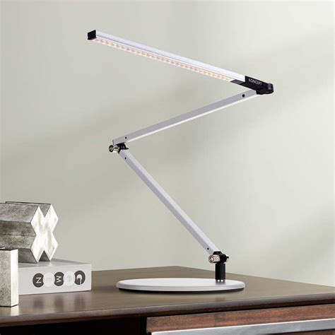 The lamp has a streamlined counterweight design that balances the body of the lamp on a slight stand and weighted base while the led head tilts and maintain its angle until you change it. Gen 3 Z-Bar Mini Warm LED Silver Desk Lamp with Touch ...